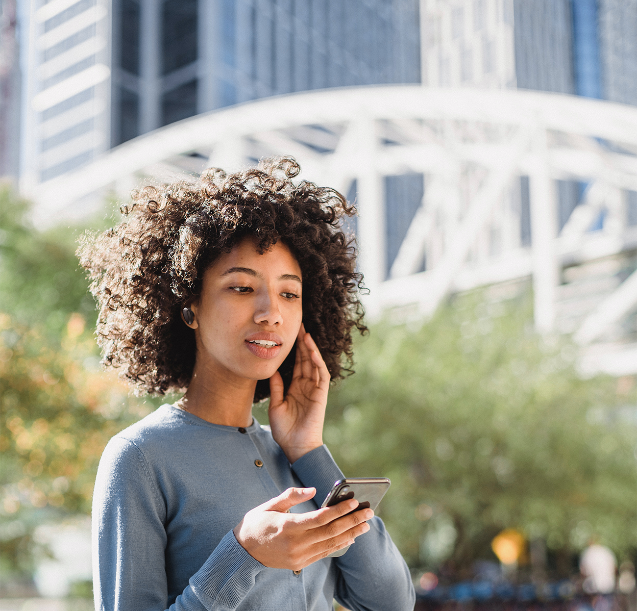 Photo of Woman with TWS MEMS speaker headset